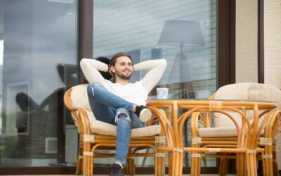 smiling-relaxed-man-enjoying-pleasant-morning-sitting-terrace-outdoor